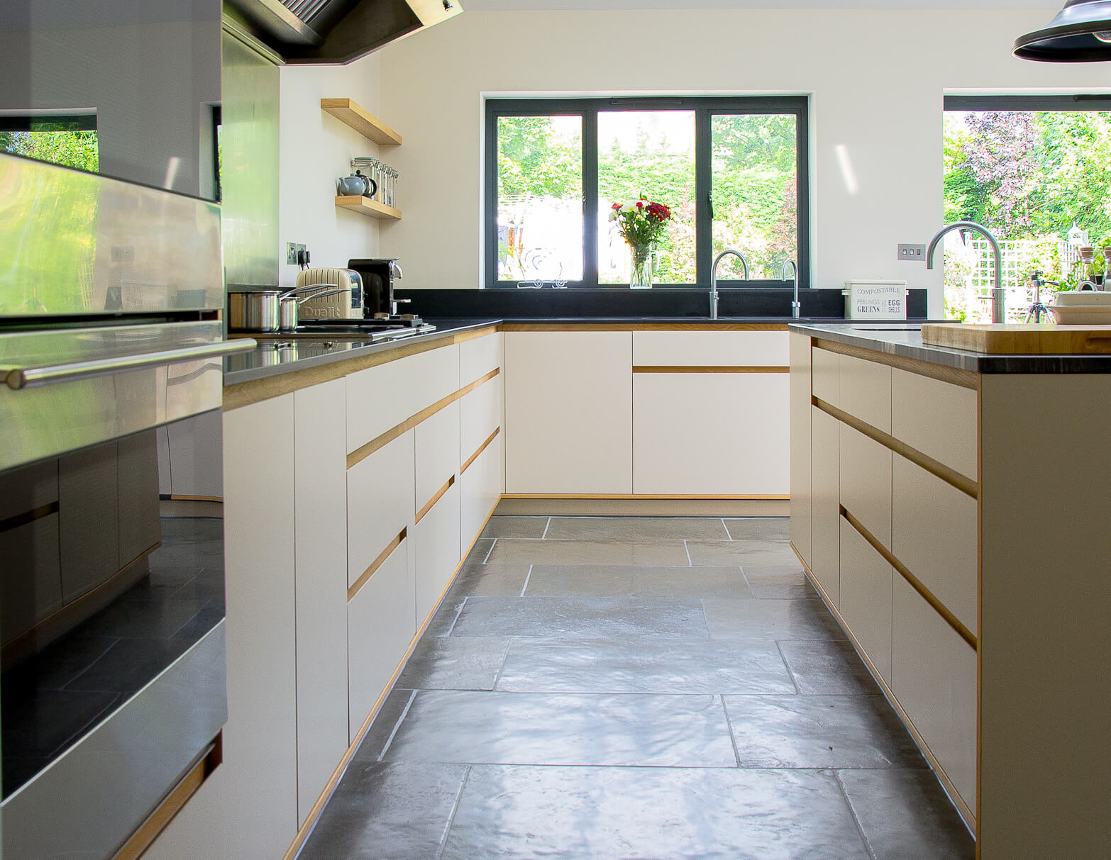 Heath Drive large hand made bespoke kitchen with birch plywood and laminate fronts, marble worktops and oak details made in Whitstable, Kent.